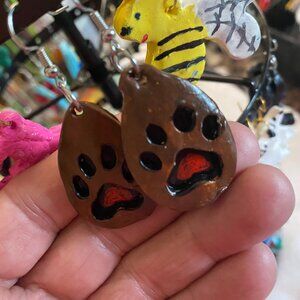 Clay brown paw prints dangling earring